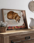 Framed painting of a dog on a wooden surface with a pitcher and basket.
