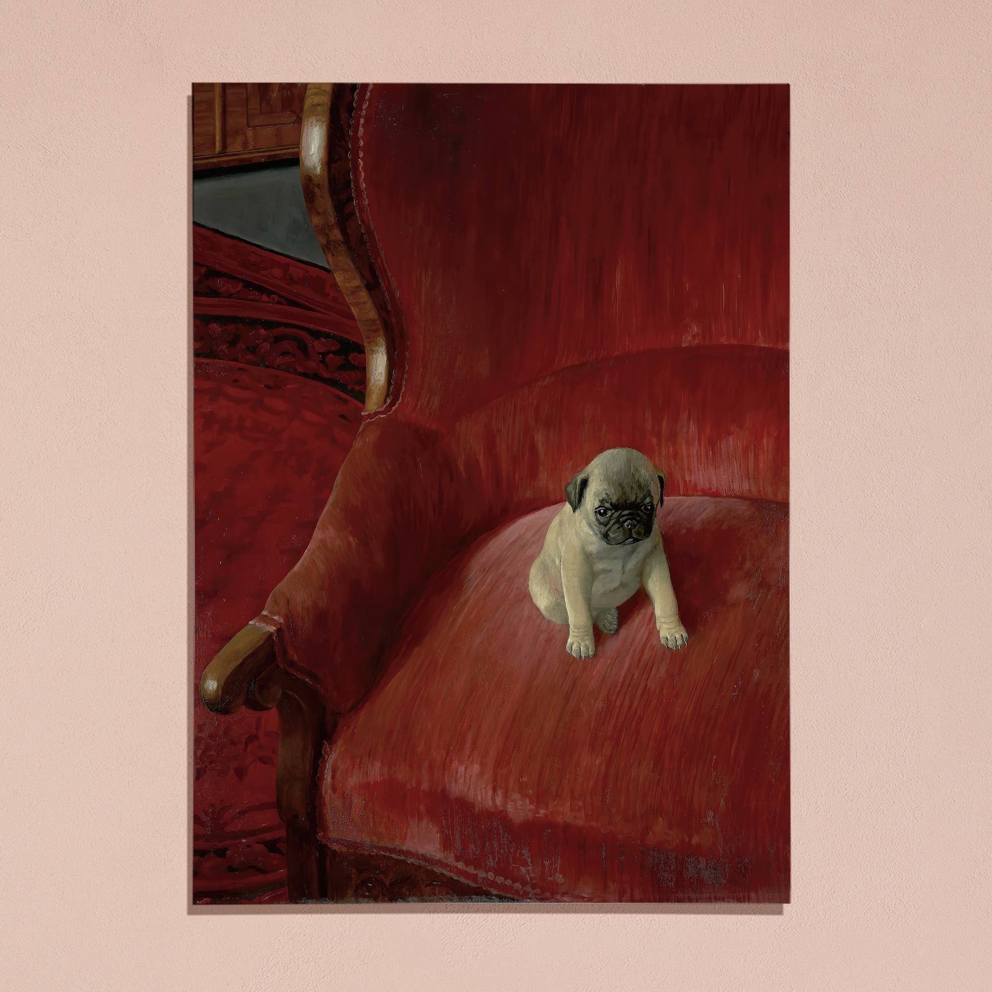Puppy sitting on a red velvet chair with a pink border