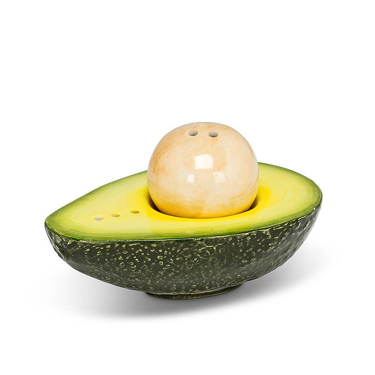 Spice up guacamole and so much more with this realistic-looking Avocado and Pit Salt &amp; Pepper Shaker set. Crafted out of ceramic, this beautifully painted faux-avocado and pit look just like the real thing — the perfect complement to any Mexican-food lover's dining table.