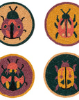 Set of 4 beaded coasters featuring unique beetle designs from Danica Studio’s Amulet collection. Made with glass beads and durable fabric for everyday use.