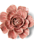 Pink ceramic flower on a white background