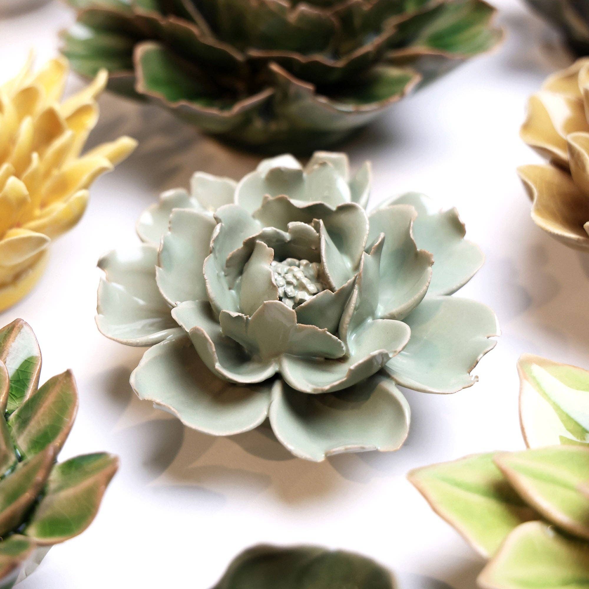 Bring everlasting blooms into your space with ceramic flowers—beautiful, handmade pieces that add a touch of nature-inspired charm without the upkeep. Each flower comes packaged in a lovely gift box and features a keyhole back, so you can display it on a wall or style it on a tabletop. Perfect for creating a blooming statement that never fades.