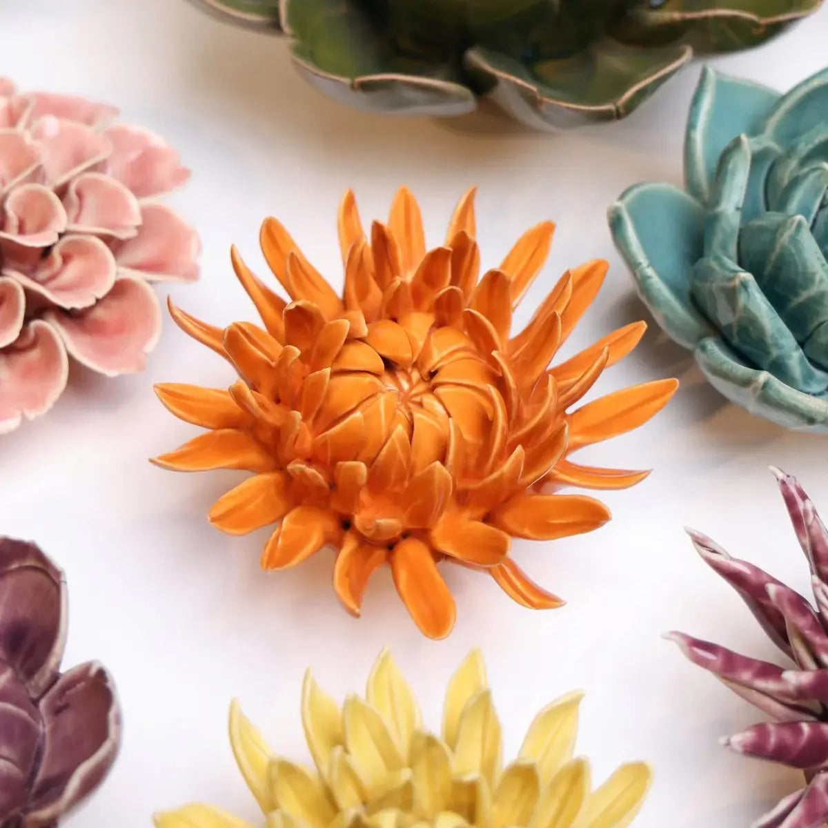 Bring everlasting blooms into your space with ceramic flowers—beautiful, handmade pieces that add a touch of nature-inspired charm without the upkeep. Each flower comes packaged in a lovely gift box and features a keyhole back, so you can display it on a wall or style it on a tabletop. Perfect for creating a blooming statement that never fades.