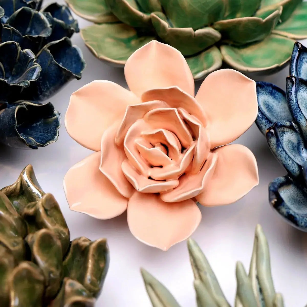 Bring everlasting blooms into your space with ceramic flowers—beautiful, handmade pieces that add a touch of nature-inspired charm without the upkeep. Each flower comes packaged in a lovely gift box and features a keyhole back, so you can display it on a wall or style it on a tabletop. Perfect for creating a blooming statement that never fades.