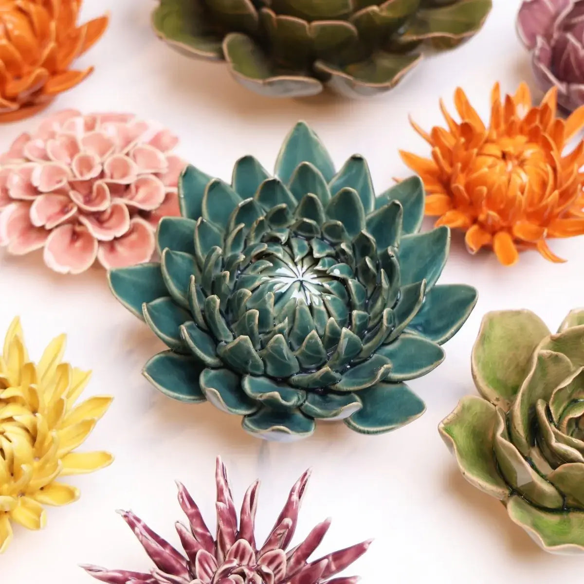 Bring everlasting blooms into your space with ceramic flowers—beautiful, handmade pieces that add a touch of nature-inspired charm without the upkeep. Each flower comes packaged in a lovely gift box and features a keyhole back, so you can display it on a wall or style it on a tabletop. Perfect for creating a blooming statement that never fades.