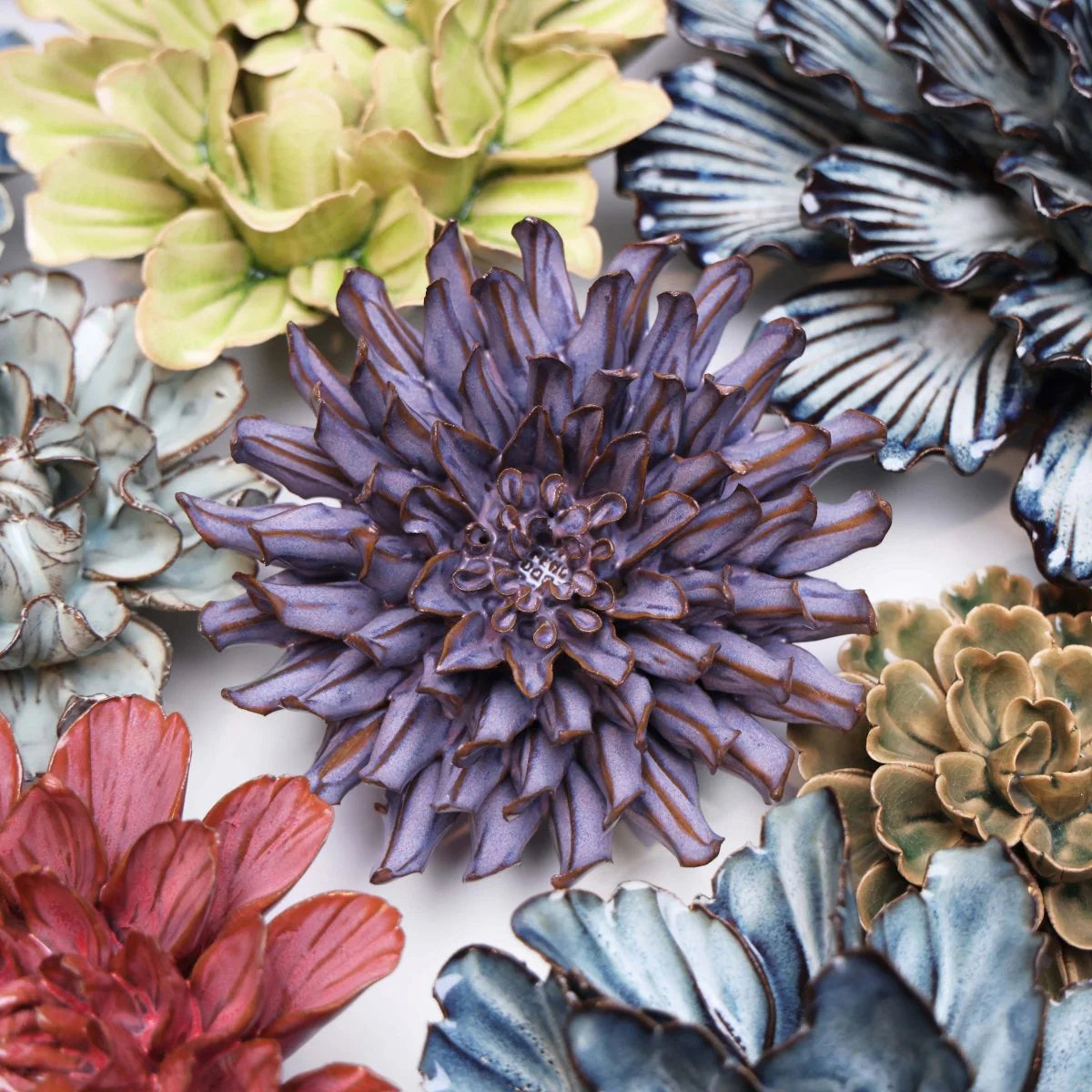 Bring everlasting blooms into your space with ceramic flowers—beautiful, handmade pieces that add a touch of nature-inspired charm without the upkeep. Each flower comes packaged in a lovely gift box and features a keyhole back, so you can display it on a wall or style it on a tabletop. Perfect for creating a blooming statement that never fades.