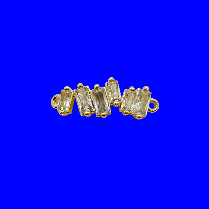 Add a sleek, sparkling touch to your charm creation. Our 18k gold-plated baguette charm features multiple sparkling gemstones set in a row, creating a refined, glimmering accent for your bracelet or necklace. This charm features two connection rings, allowing it to sit flush without dangling.&nbsp;It adds a refined, luminous accent to your charm collection and layers effortlessly with other pieces for a smooth, elegant look.