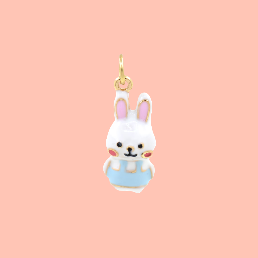 The cutest little cottontail you ever did see, now in charm form. This enamel bunny charm features an adorable white rabbit with pink ears, rosy cheeks, and a sweet light blue outfit — delightfully detailed and impossible not to smile at. A fun and irresistible novelty charm that pairs beautifully with both premium gold-filled pieces and colorful novelty charms on any bracelet, necklace, or earring.