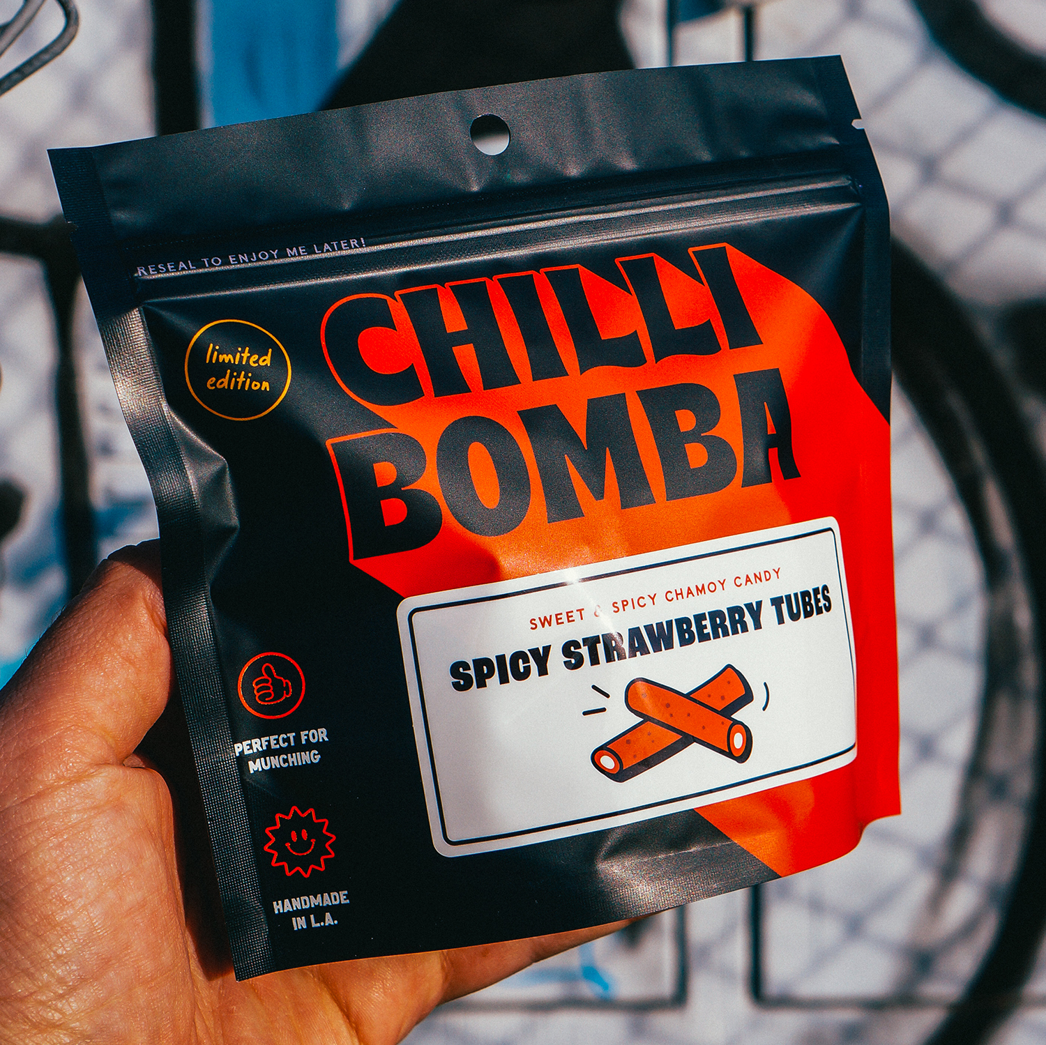 Spicy Strawberry Tubes filled with vanilla and coated in chamoy chili. Sweet, sour, and spicy candy with bold flavor. Made fresh weekly in the USA.
