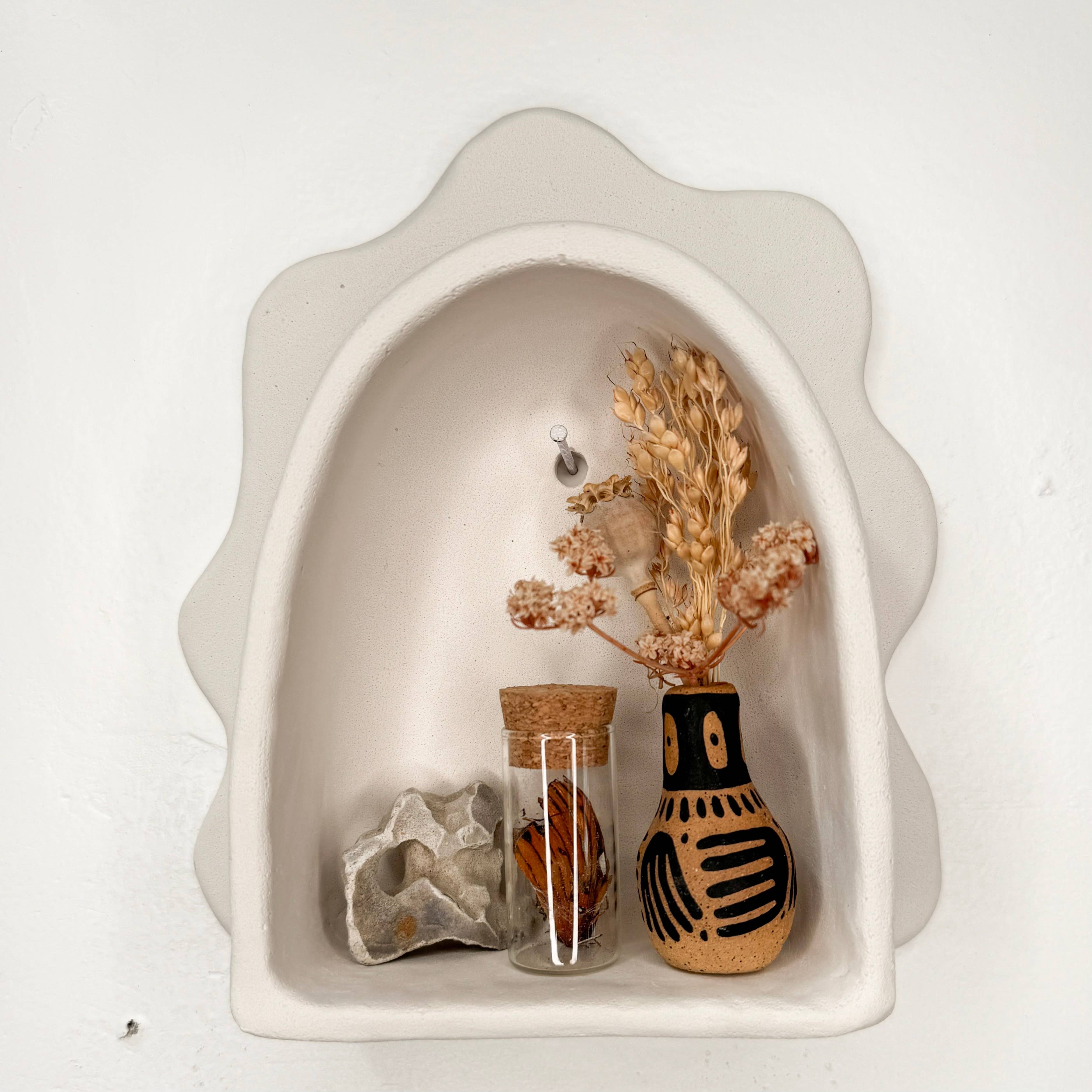 Handmade Cloud Arch curio shelf by The Minimalist Ceramist. Perfect for displaying crystals, rocks, air plants, pinecones, and nature-inspired treasures.