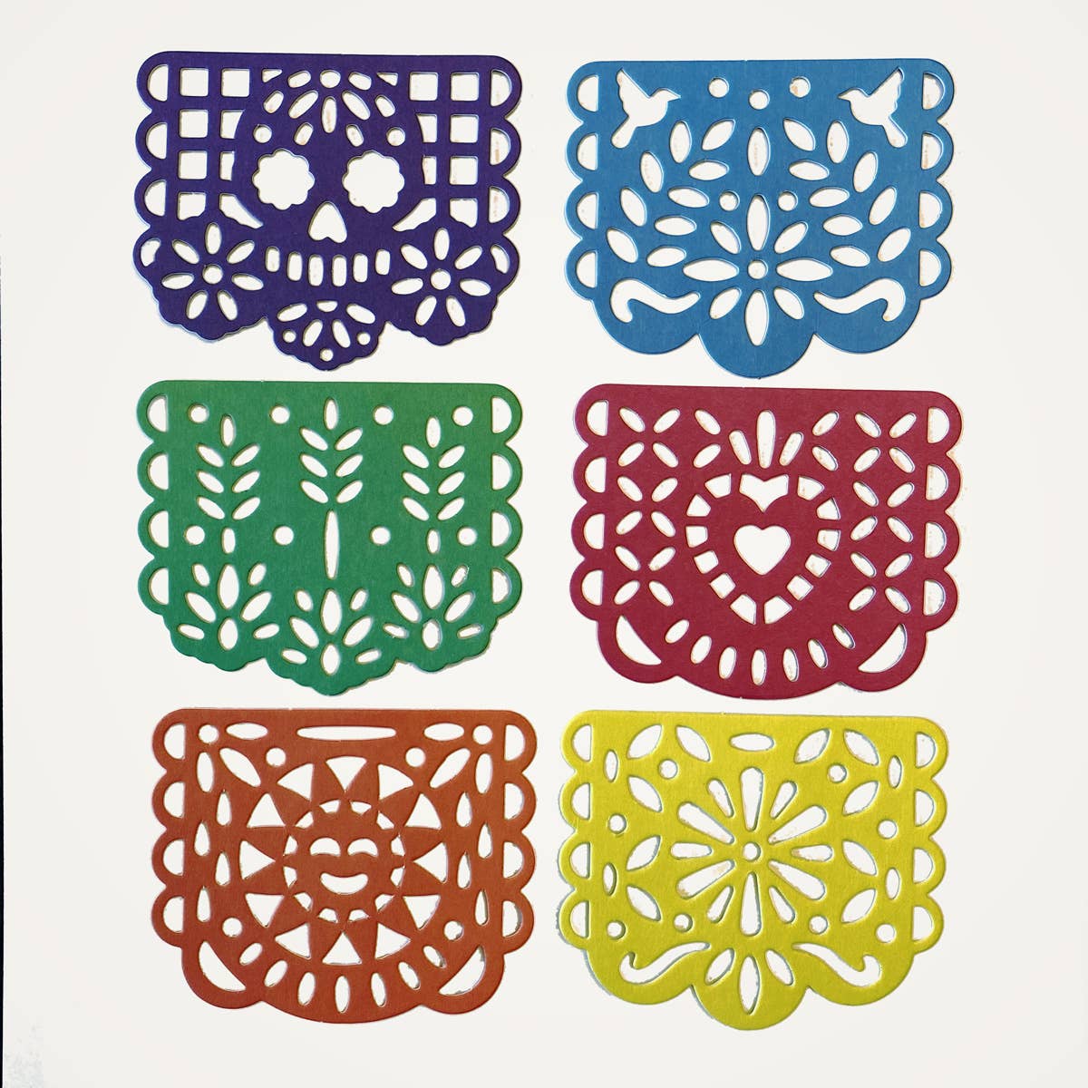 Add fiesta flair with Papel Picado Coasters! Bright, intricate, and fun, these festive paper coasters protect surfaces while bringing color to any celebration.