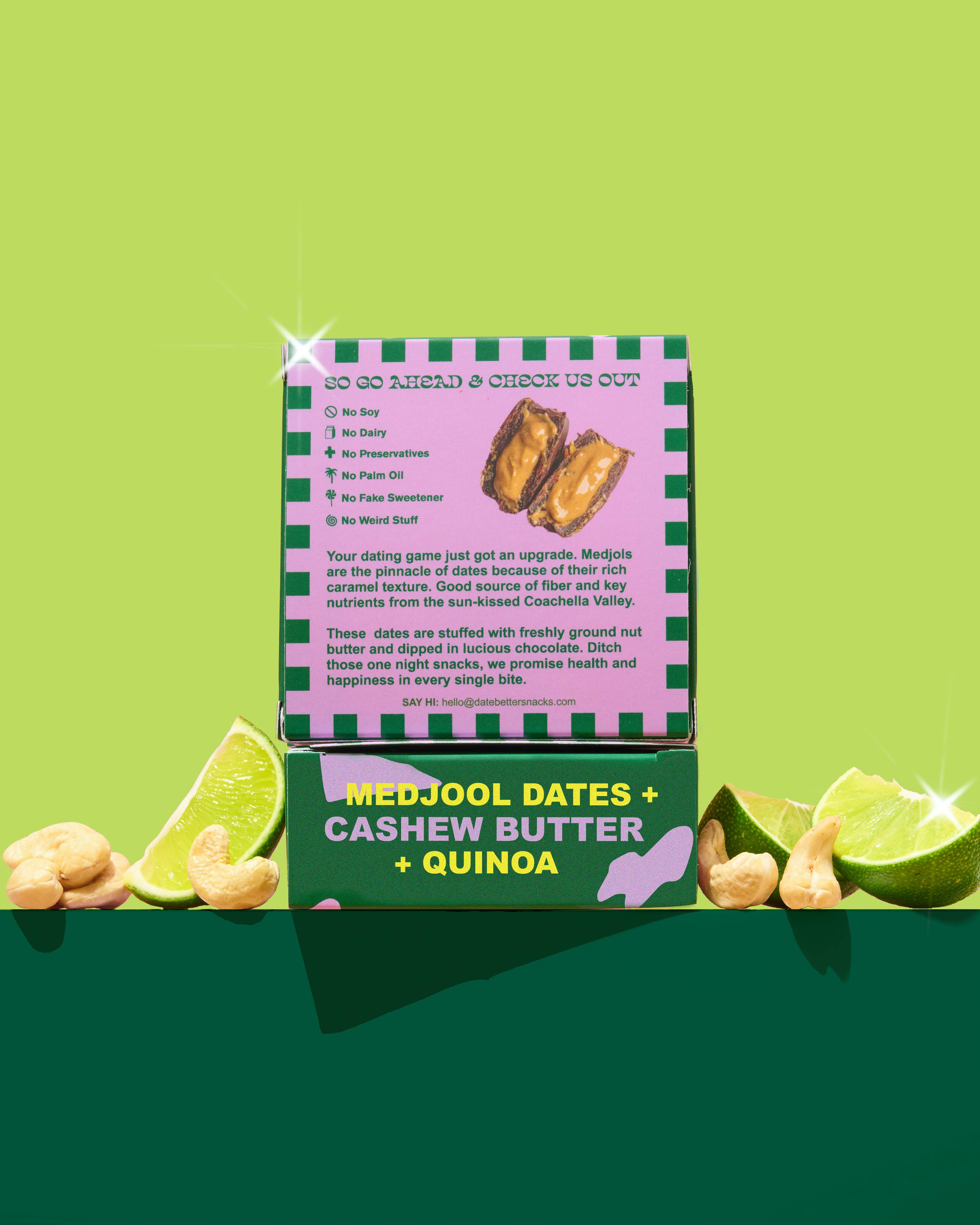 Box of Medjool Dates, Cashew Butter, and Quinoa with ingredients listed on a green background