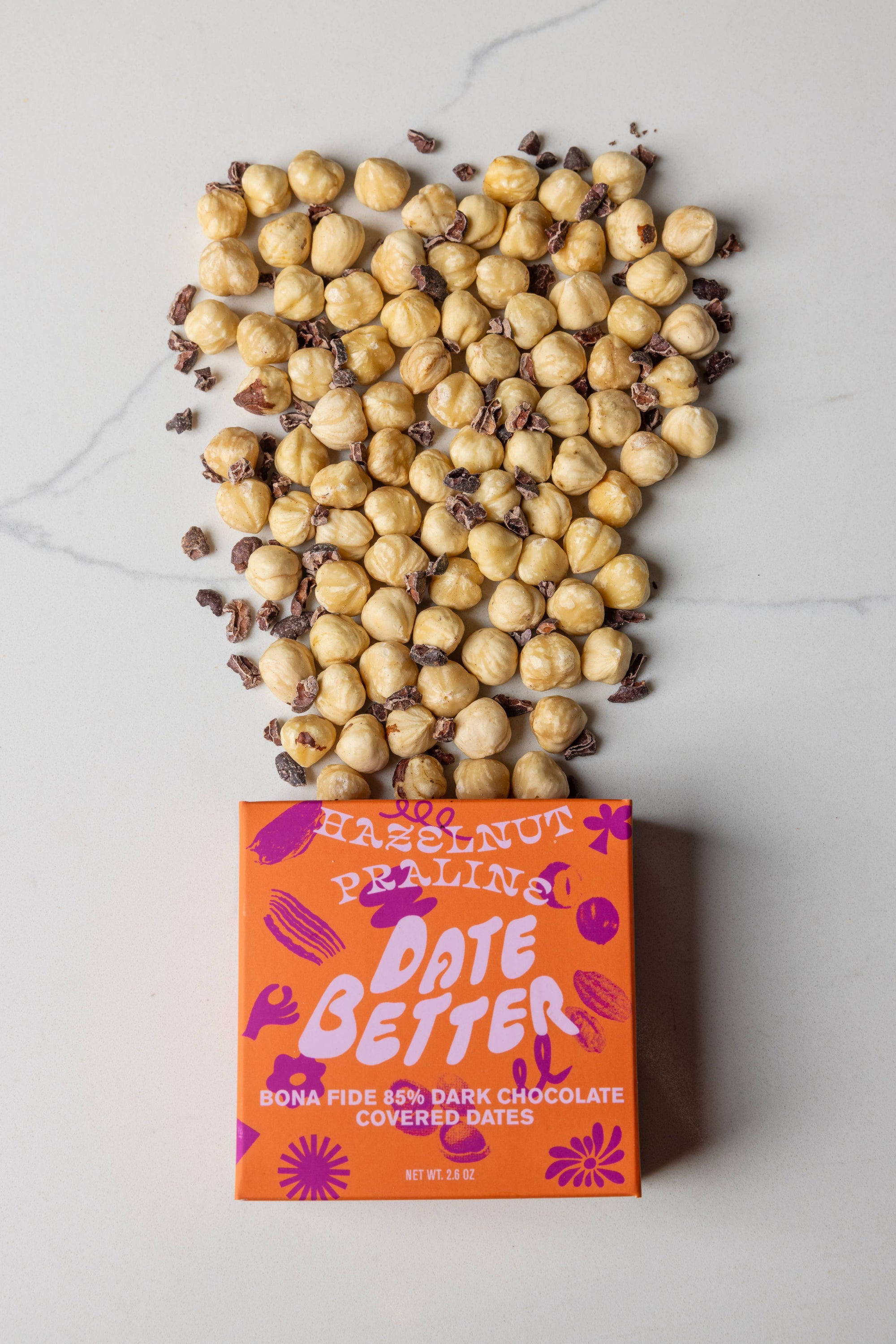 Box of 'Date Better' chocolate-covered dates with hazelnuts on top
