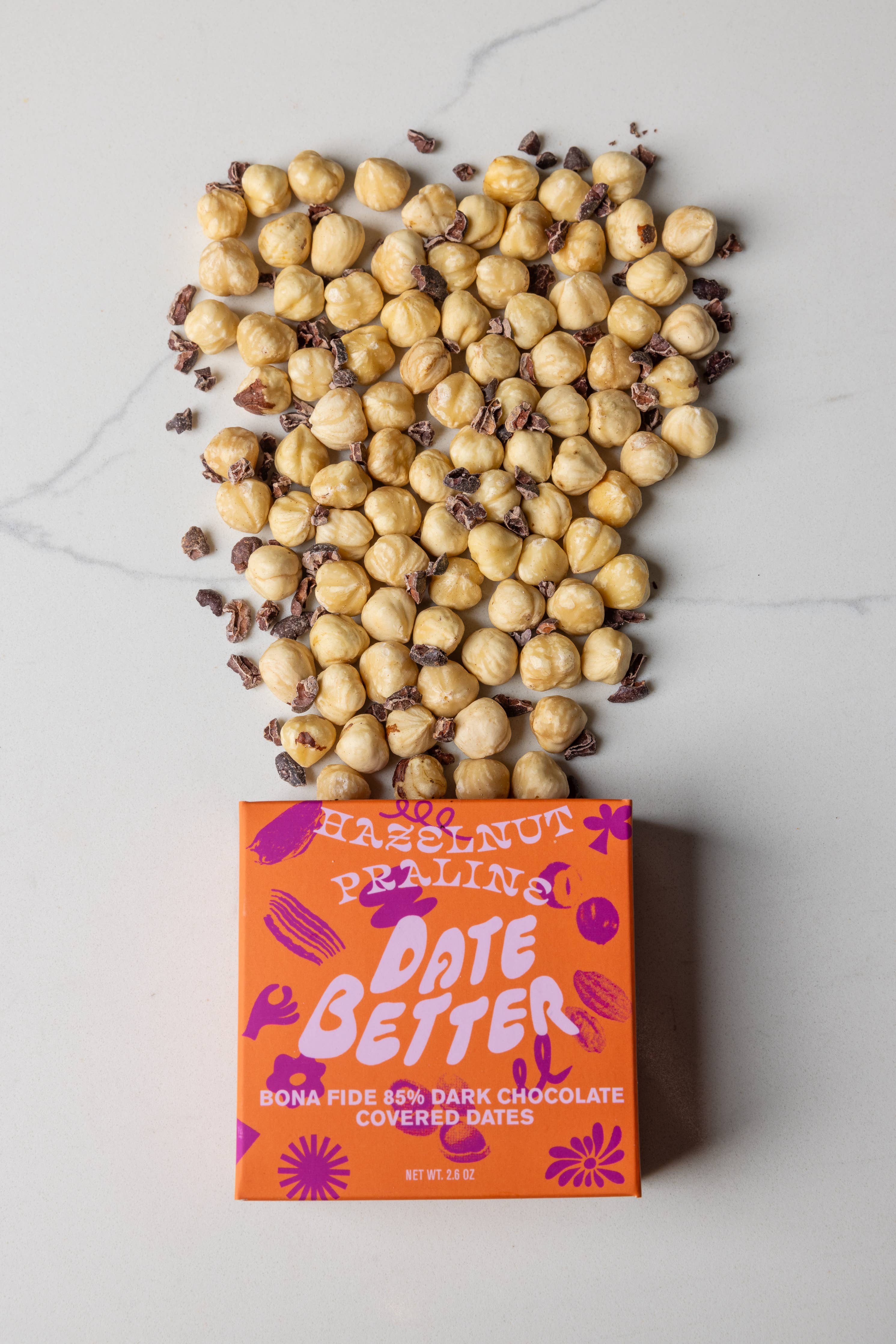 Box of 'Date Better' chocolate-covered dates with hazelnuts on top