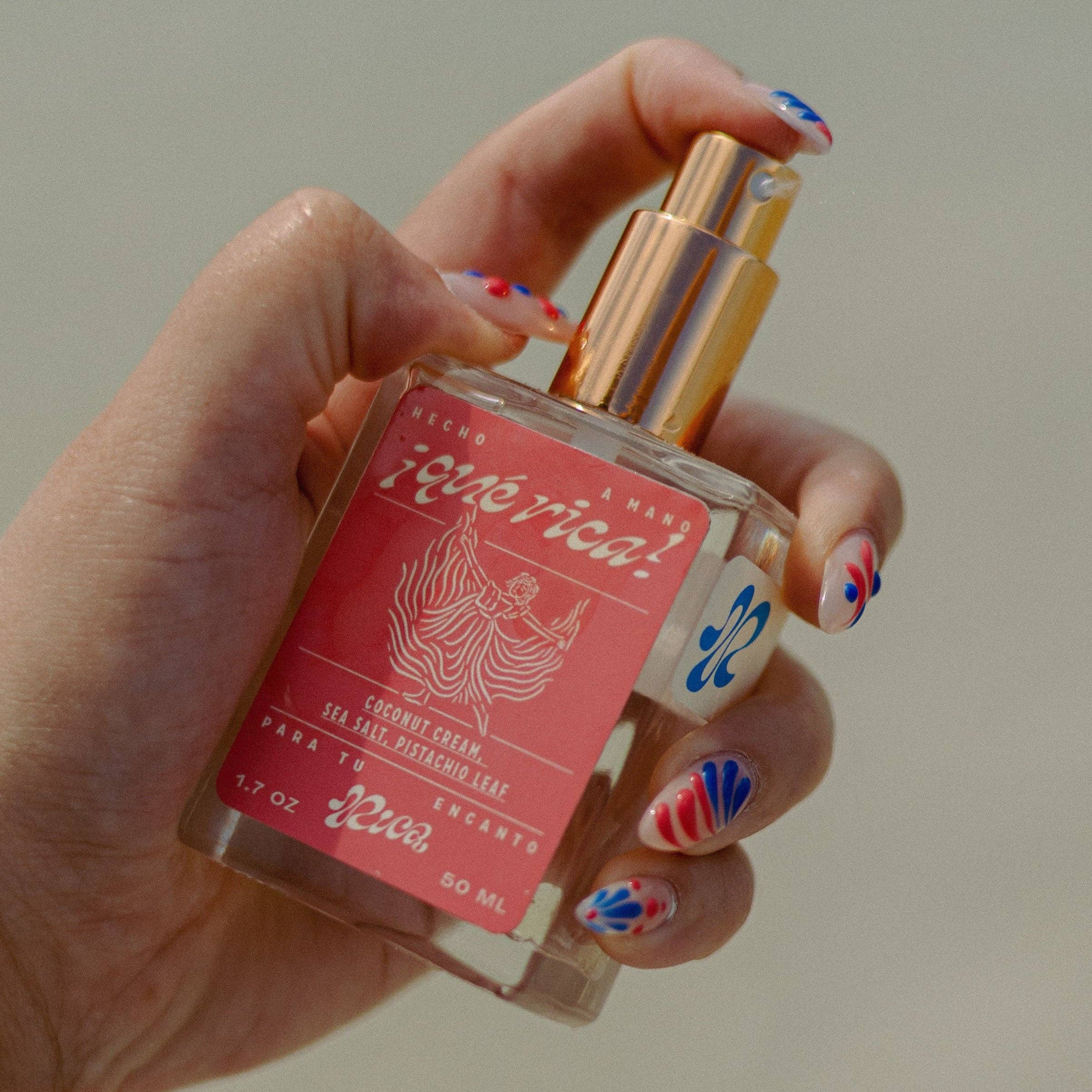 Dive into the sultry allure of ¡Qué Rica!—an eau de parfum that strikes the perfect balance of sweet and salty. This perfume mist is derived from essential oils and crafted to transport you with every spritz.

Top Notes: Coconut cream, sea salt, citrus zest
Middle Notes: Vanilla crème, jasmine blossom
Base Notes: Sandalwood, amber, cedar
