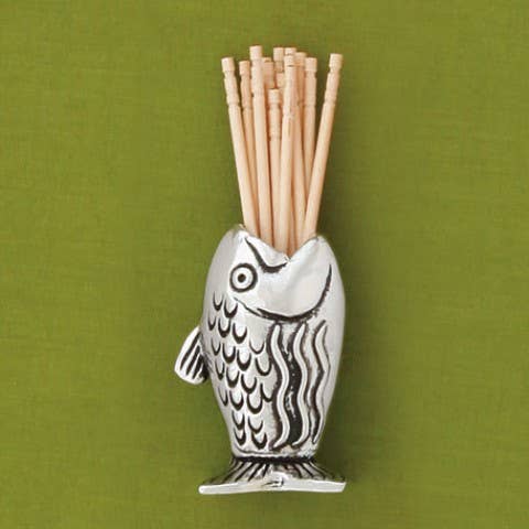 Keep your toothpicks within reach with a playful Fish Toothpick Holder. It's the perfect gift for the avid fisherman in your life or someone that just enjoys a cute table accessory. It's not just for toothpicks; it makes a great match holder too! Fine hand-crafted pewter, made in Canada.