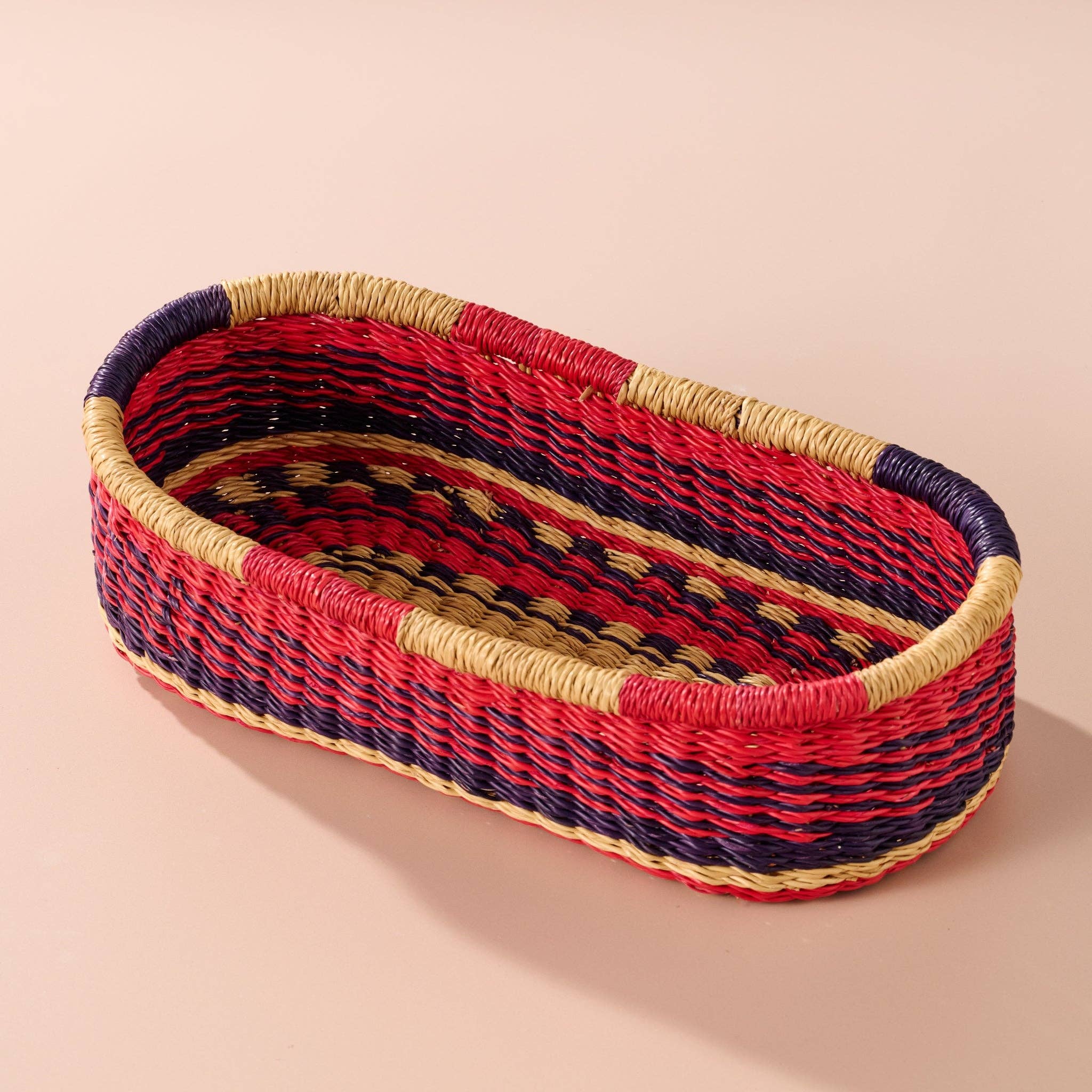 Add these bright, handcrafted baskets to your table, shelf or closet - the uses are limited only by your imagination! Gorgeously handwoven from locally sourced veta vera grass, the utilitarian design features an assortment of vibrant colors. Each one is woven while wet and can be re-shaped by adding water, perfect for the kitchen and bath! Durable and washable, these baskets are a beautiful and unique addition to any decor.&nbsp;