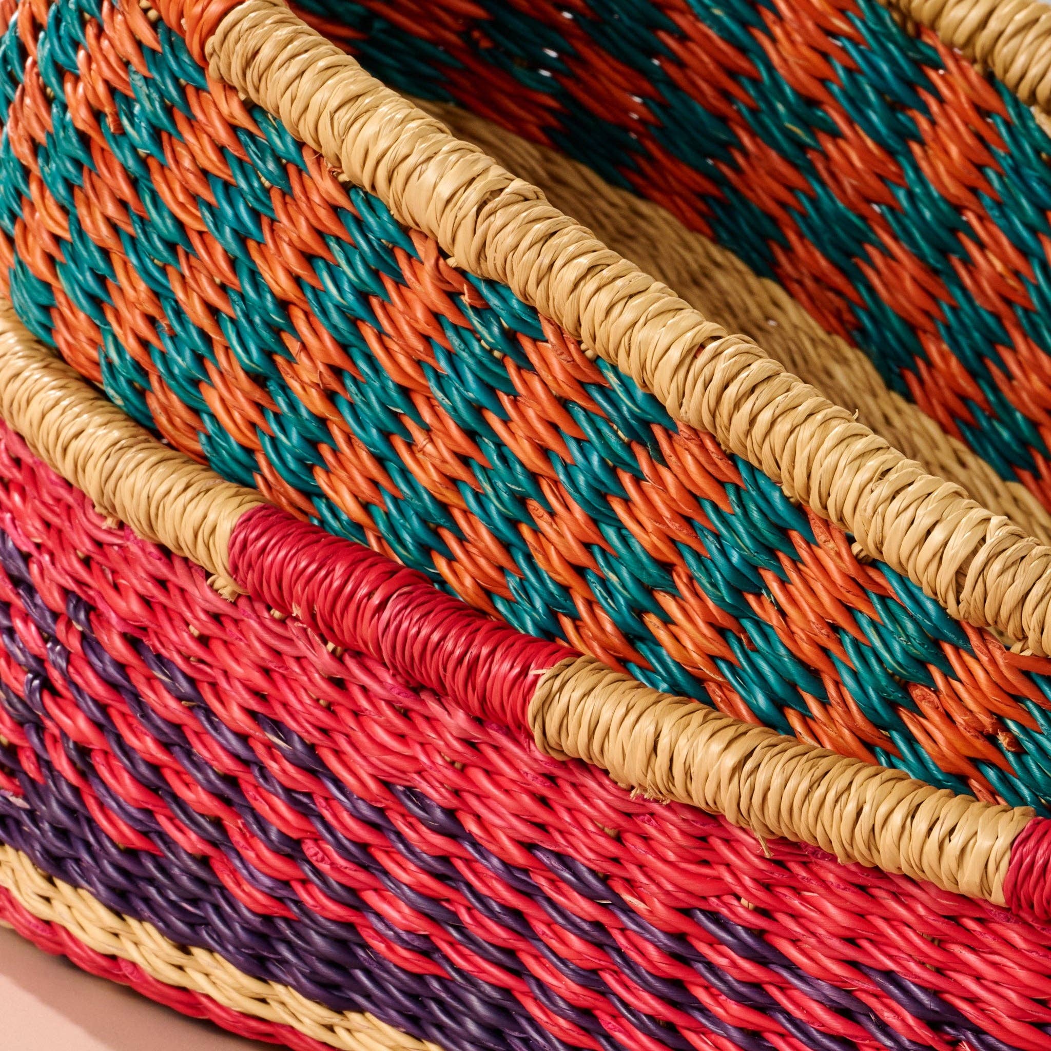 Add these bright, handcrafted baskets to your table, shelf or closet - the uses are limited only by your imagination! Gorgeously handwoven from locally sourced veta vera grass, the utilitarian design features an assortment of vibrant colors. Each one is woven while wet and can be re-shaped by adding water, perfect for the kitchen and bath! Durable and washable, these baskets are a beautiful and unique addition to any decor.&nbsp;