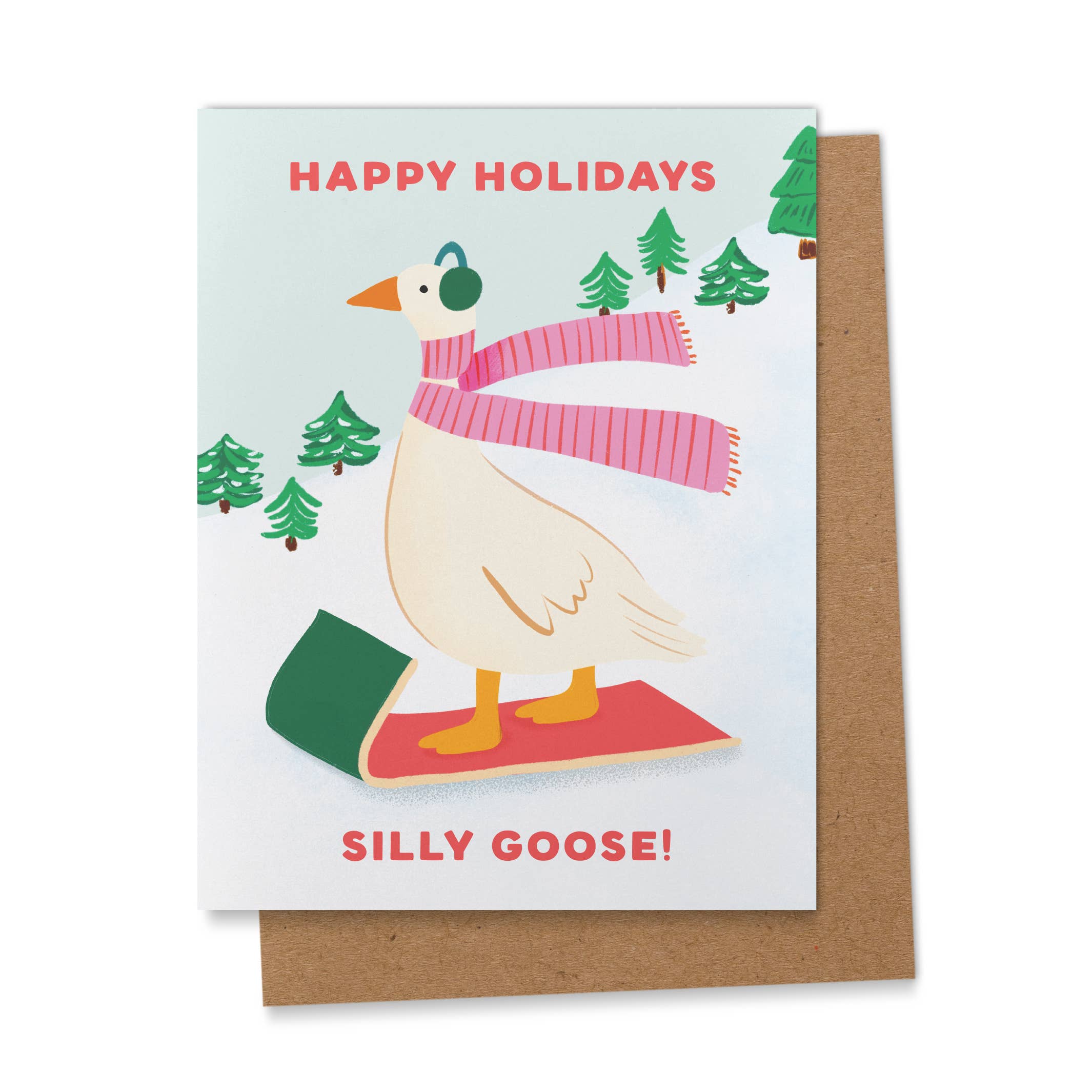 Spread some holiday cheer with Ana Peake’s “Silly Goose” Greeting Card, featuring a playful goose sledding down a snowy hill in a cozy scarf and earmuffs. This whimsical design perfectly captures the fun, lighthearted spirit of the season—ideal for sending smiles to friends and loved ones.