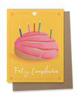 This colorful birthday card features a perfect pink concha adorned with birthday candles. Celebrate Hispanic Heritage Month with Ana Peake's Spanish Greeting Cards, adorned with stunning Mexican Folk Art Inspired Illustrations! These beautifully designed cards, perfect for honoring Hispanic heritage and spreading joy on special occasions.