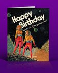 Birthday card with retro-style illustration of two astronauts on a purple background