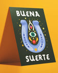 Ana Peake presents Spanish Greeting Cards to convey good luck! Sized A2,&nbsp; these cards are crafted from uncoated paper and feature a blank interior for personalized messages. Each card comes complete with a Kraft Brown Envelope and Plastic Sleeve for protection. Made in the U.S.A., these cards embody quality and cultural expression, making them perfect for various occasions.