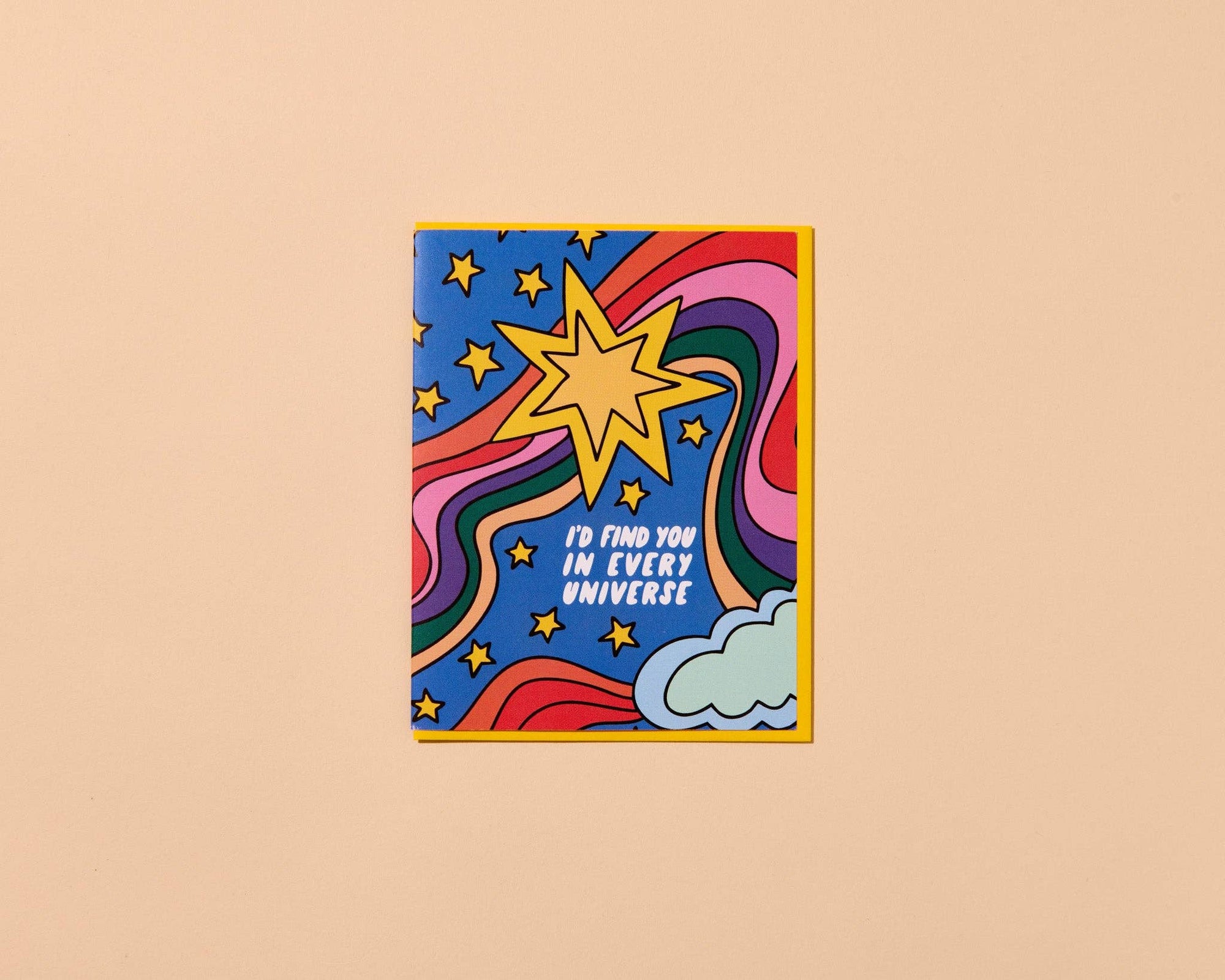 Colorful card with star and cloud design on a beige background