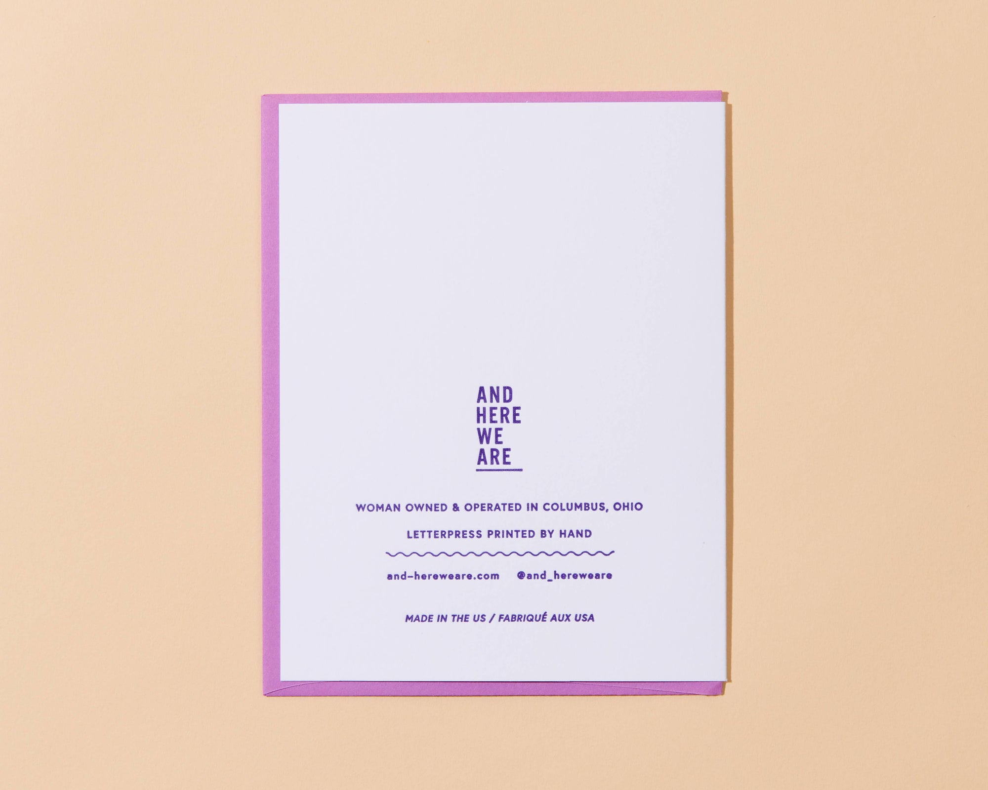 Letterpress printed card with text on a beige background