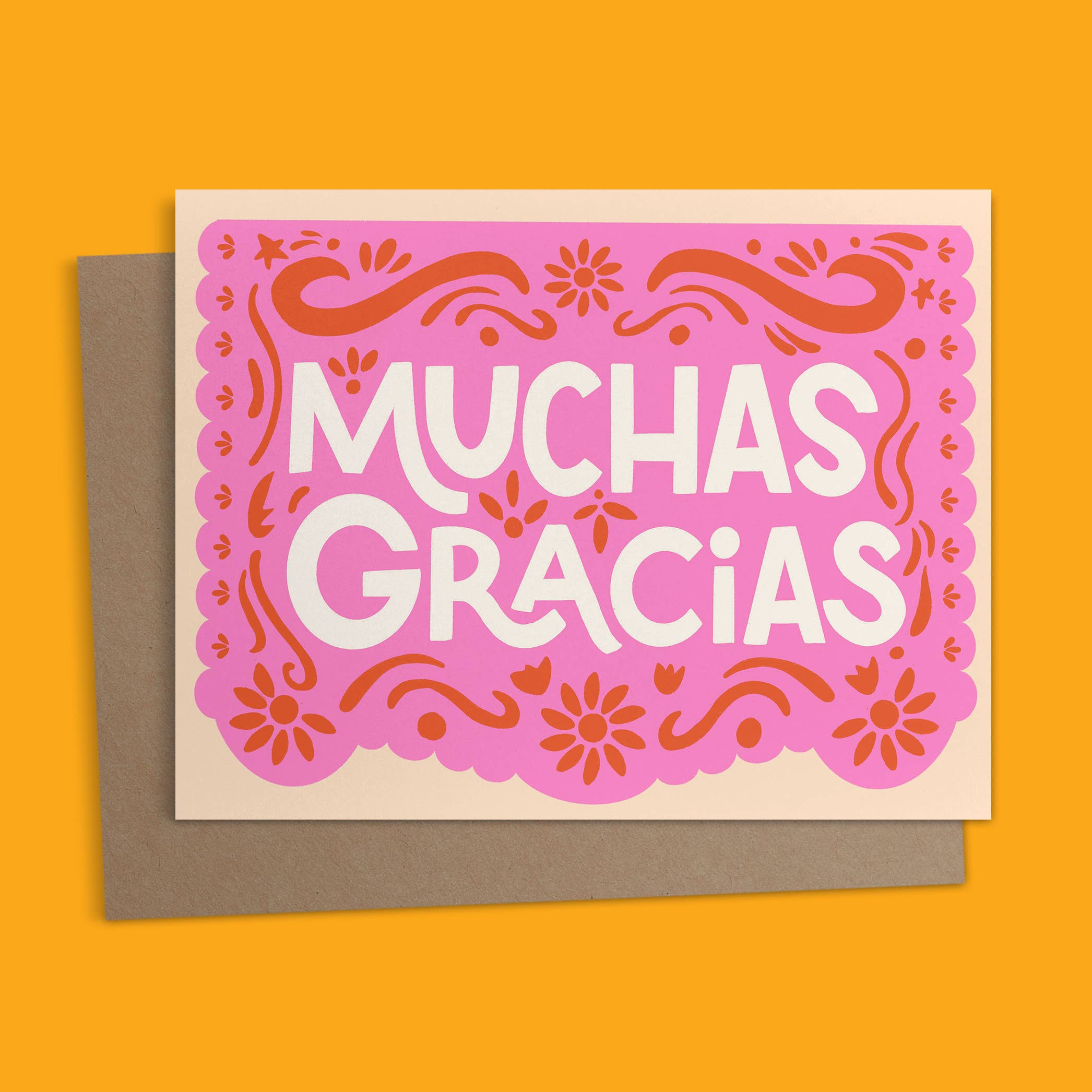 Say thanks with Ana Peake’s “Papel Picado” Greeting Card, featuring a vibrant pink design inspired by traditional Mexican folk art. Perfect for festively expressing gratitude.