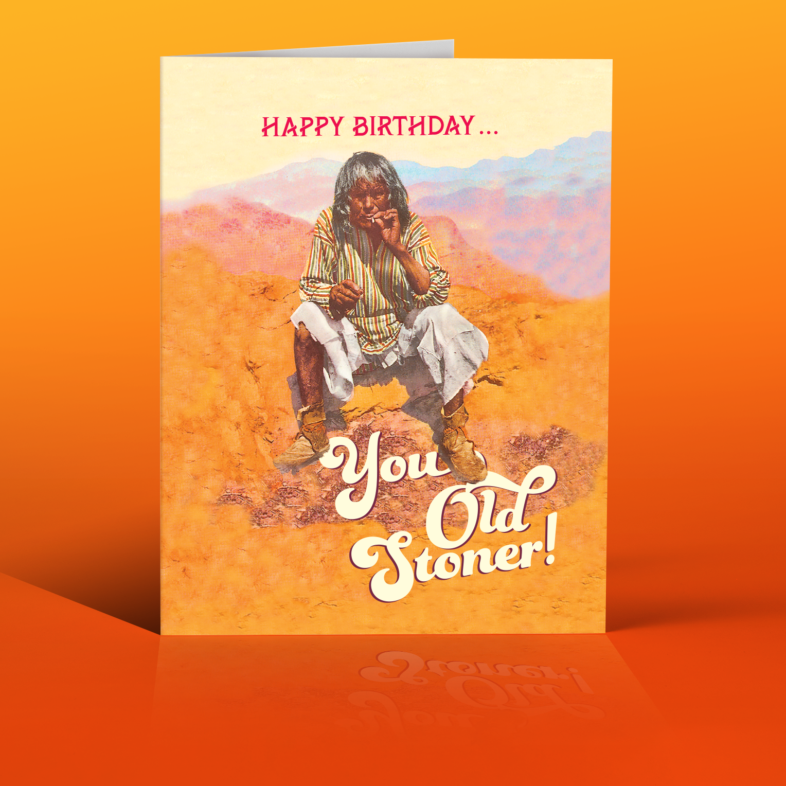Birthday card with a person smoking in a desert scene, text 'Happy Birthday.