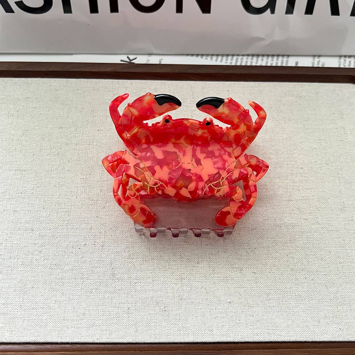 Bring a playful, beachy vibe to your hair with this red crab-shaped claw clip. Made from smooth acetate, it’s lightweight and easy to style, adding a whimsical touch to everyday looks or summer outfits. Perfect for sea-life lovers or anyone who wants a fun, cheerful accessory.