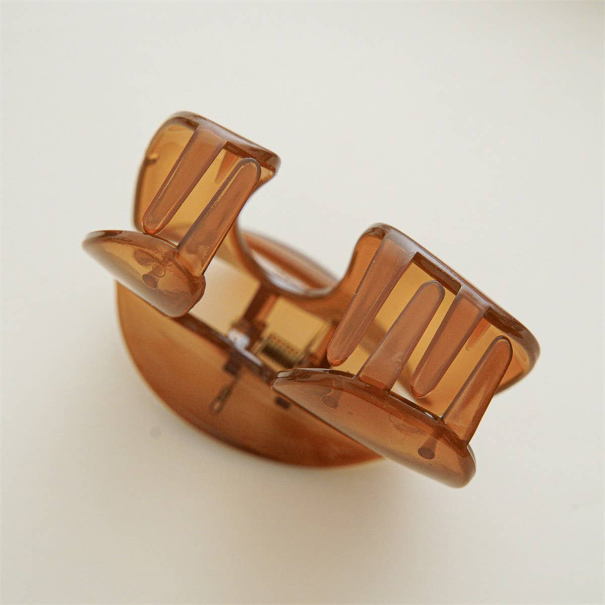 Add a subtle pop of color with this minimalist jelly green hair claw clip. Lightweight and easy to wear, it keeps hair in place while adding a soft, modern touch to any look. Perfect for everyday styling or layering with other clips for a chic, trendy vibe.