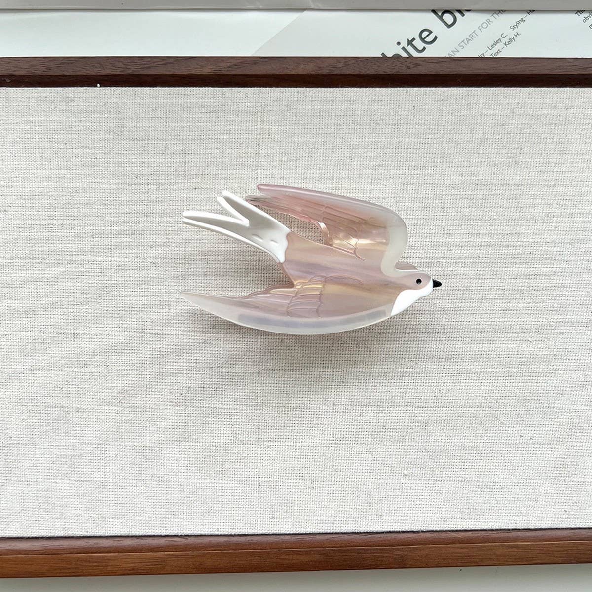 Add a touch of whimsy to your hairstyle with this pink swallow-shaped hair claw clip. Crafted from smooth acetate, it’s lightweight and easy to wear, bringing a playful, nature-inspired accent to everyday looks. Perfect for layering with other clips or wearing on its own for a charming, elegant finish.