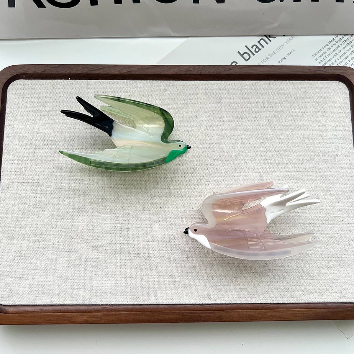 Add a touch of whimsy to your hairstyle with this pink swallow-shaped hair claw clip. Crafted from smooth acetate, it’s lightweight and easy to wear, bringing a playful, nature-inspired accent to everyday looks. Perfect for layering with other clips or wearing on its own for a charming, elegant finish.