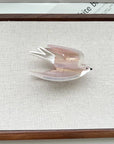 Add a touch of whimsy to your hairstyle with this pink swallow-shaped hair claw clip. Crafted from smooth acetate, it’s lightweight and easy to wear, bringing a playful, nature-inspired accent to everyday looks. Perfect for layering with other clips or wearing on its own for a charming, elegant finish.
