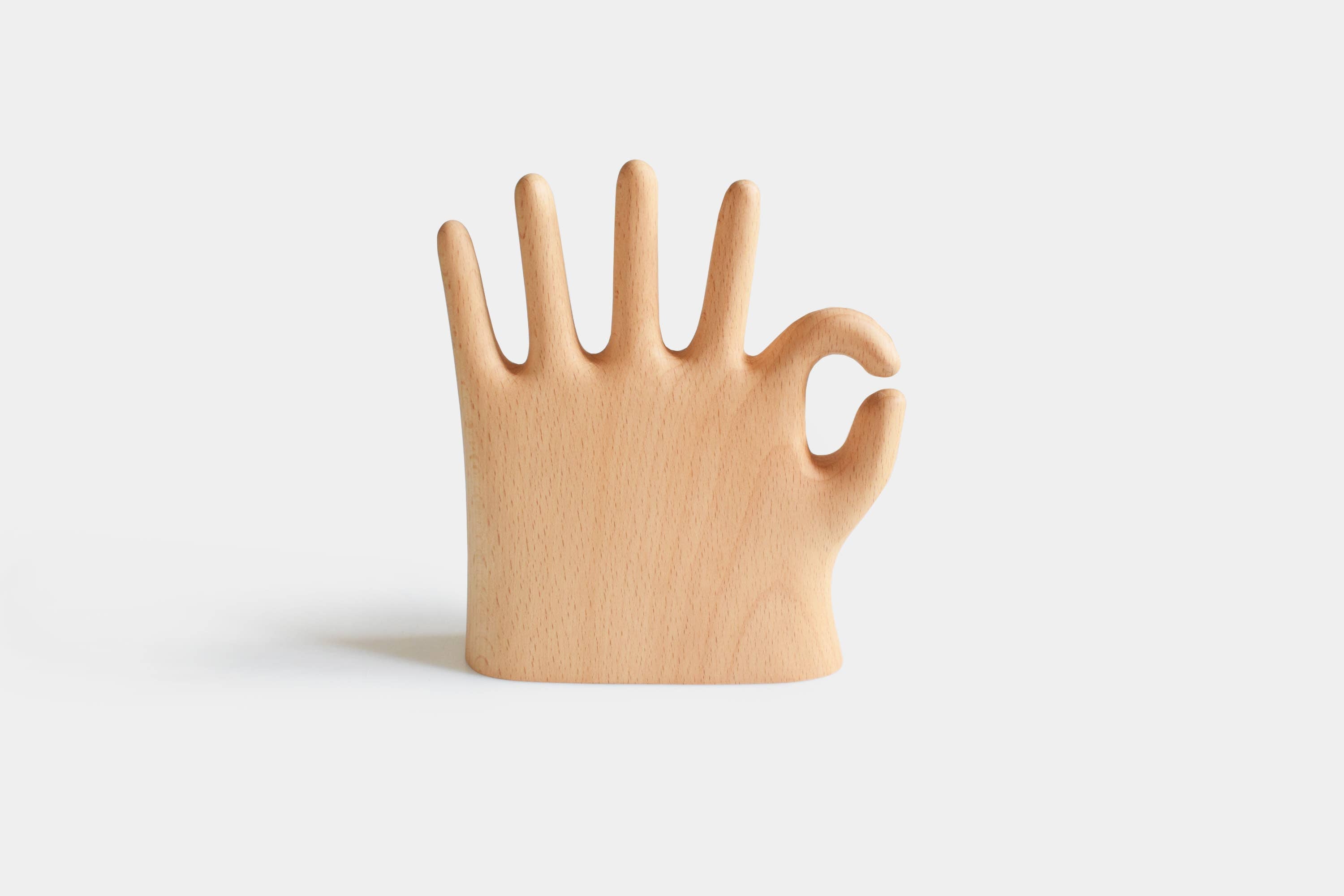 Show off your rings, necklaces, and bracelets with a touch of whimsy. This beech wood jewelry display features a hand making the classic “OK” sign with a playful twist: one extra finger (6 in total) to hold even more of your favorite pieces. Perfect for keeping your jewelry organized and adding a fun, eye-catching accent to your dresser or vanity.