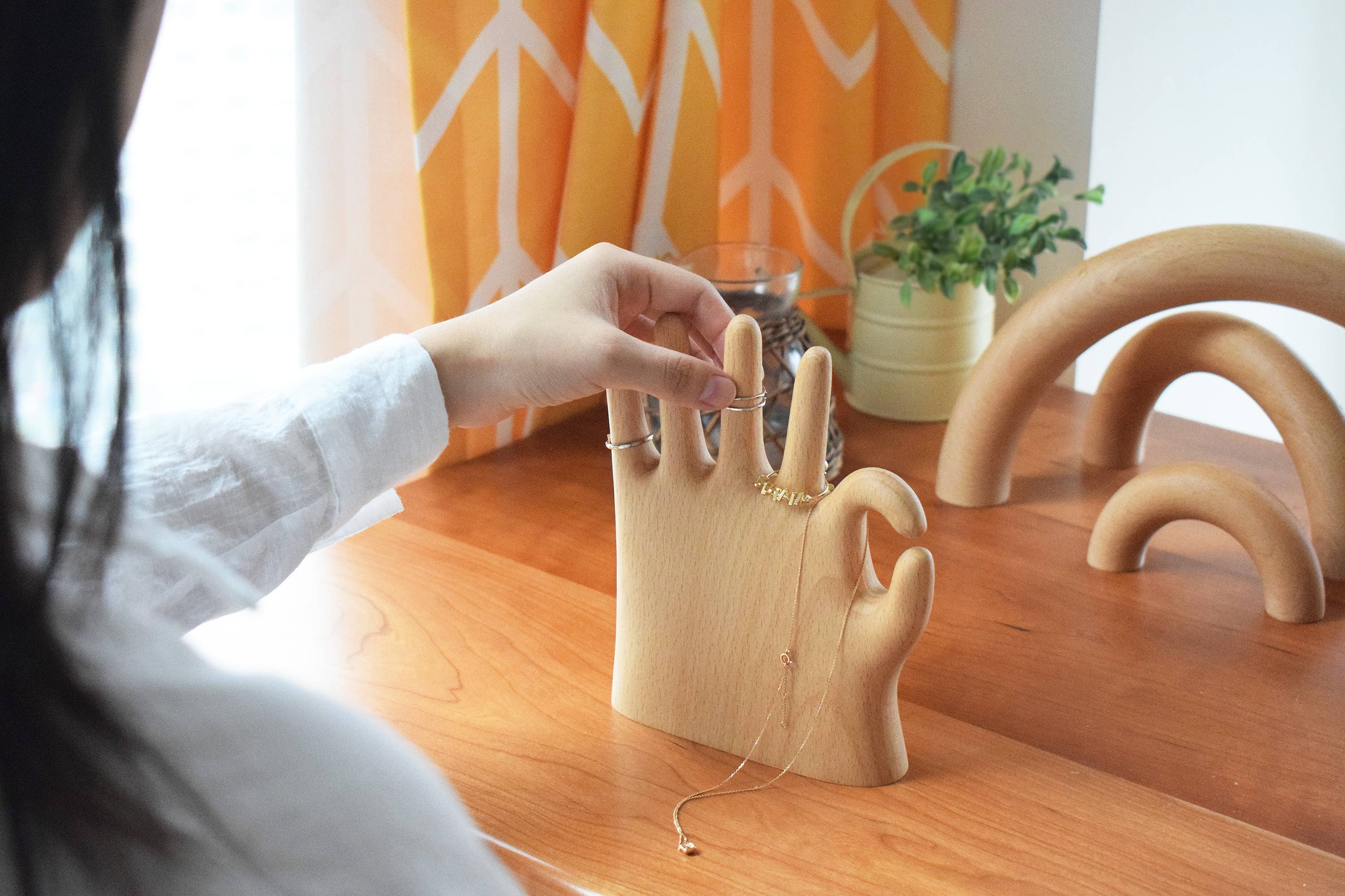 Show off your rings, necklaces, and bracelets with a touch of whimsy. This beech wood jewelry display features a hand making the classic “OK” sign with a playful twist: one extra finger (6 in total) to hold even more of your favorite pieces. Perfect for keeping your jewelry organized and adding a fun, eye-catching accent to your dresser or vanity.