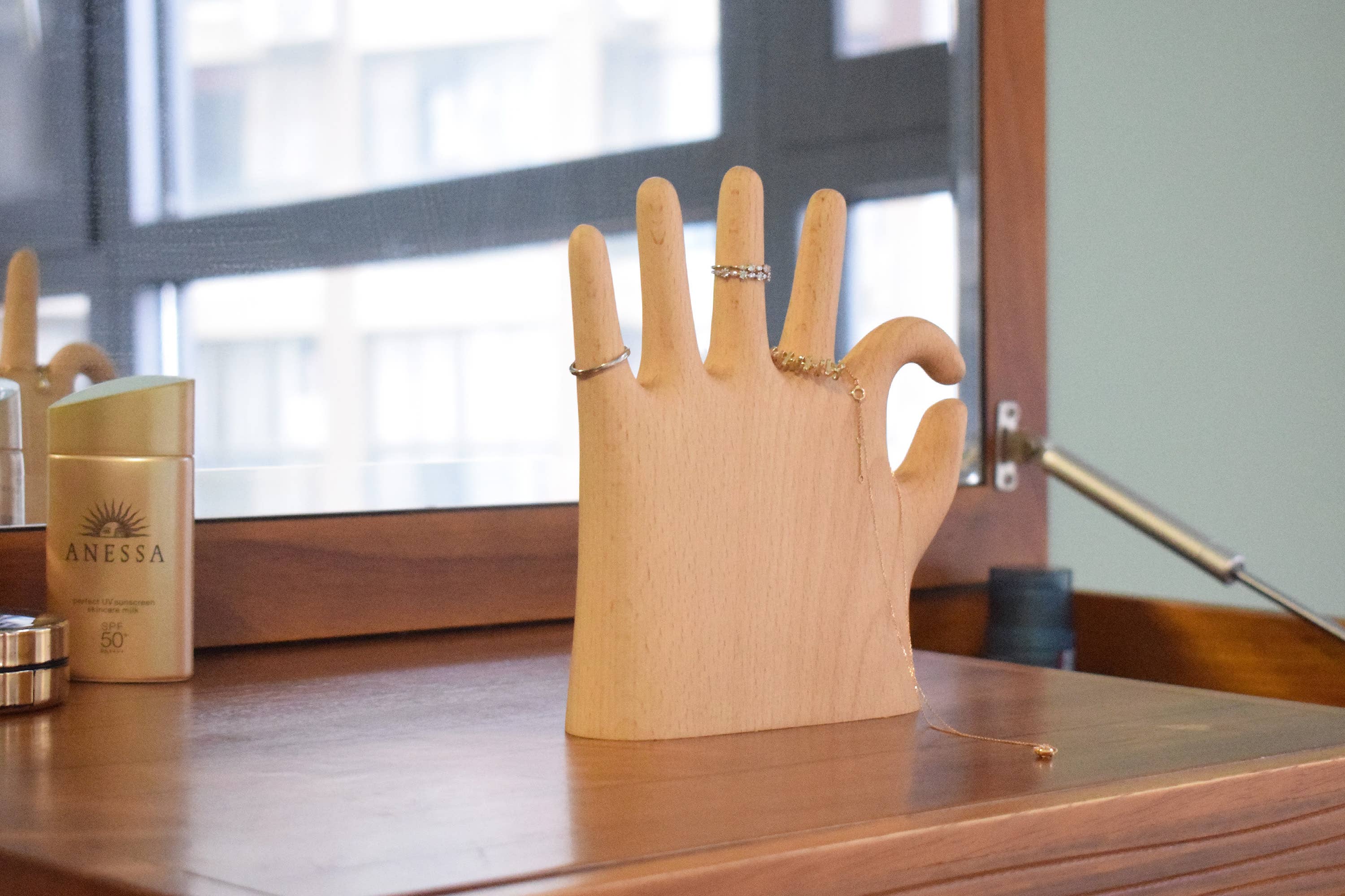 Show off your rings, necklaces, and bracelets with a touch of whimsy. This beech wood jewelry display features a hand making the classic “OK” sign with a playful twist: one extra finger (6 in total) to hold even more of your favorite pieces. Perfect for keeping your jewelry organized and adding a fun, eye-catching accent to your dresser or vanity.