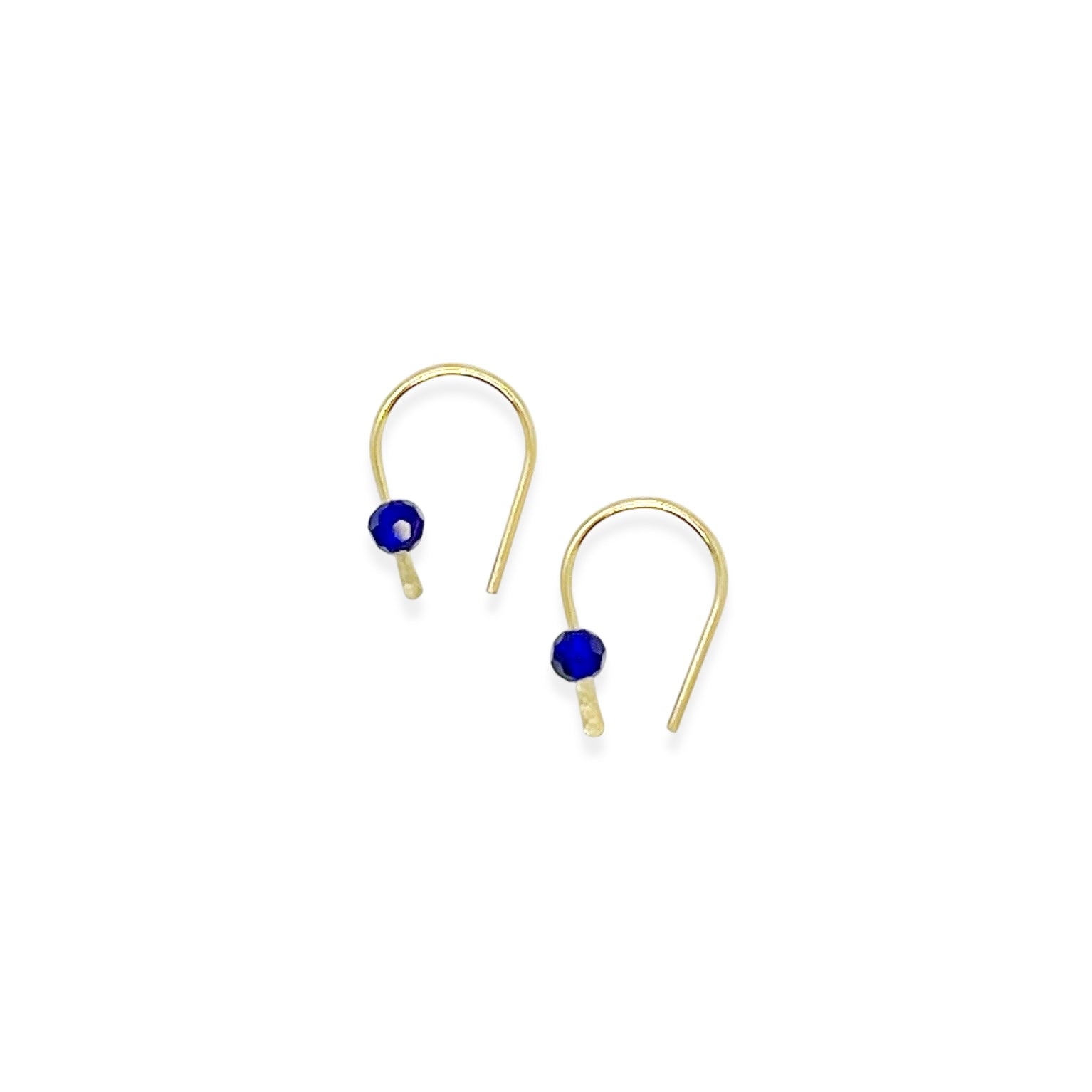 Simple and expressive, the Horseshoe Pull-Through Hoops are a fresh take on everyday earrings. Their petite arc shape hugs the lobe just right, while a single crystal adds a glint of light and intention. Minimal yet full of meaning, these are the earrings you’ll reach for again and again.
