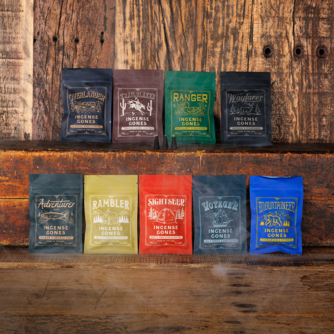 Collection of incense cone packages on a wooden shelf