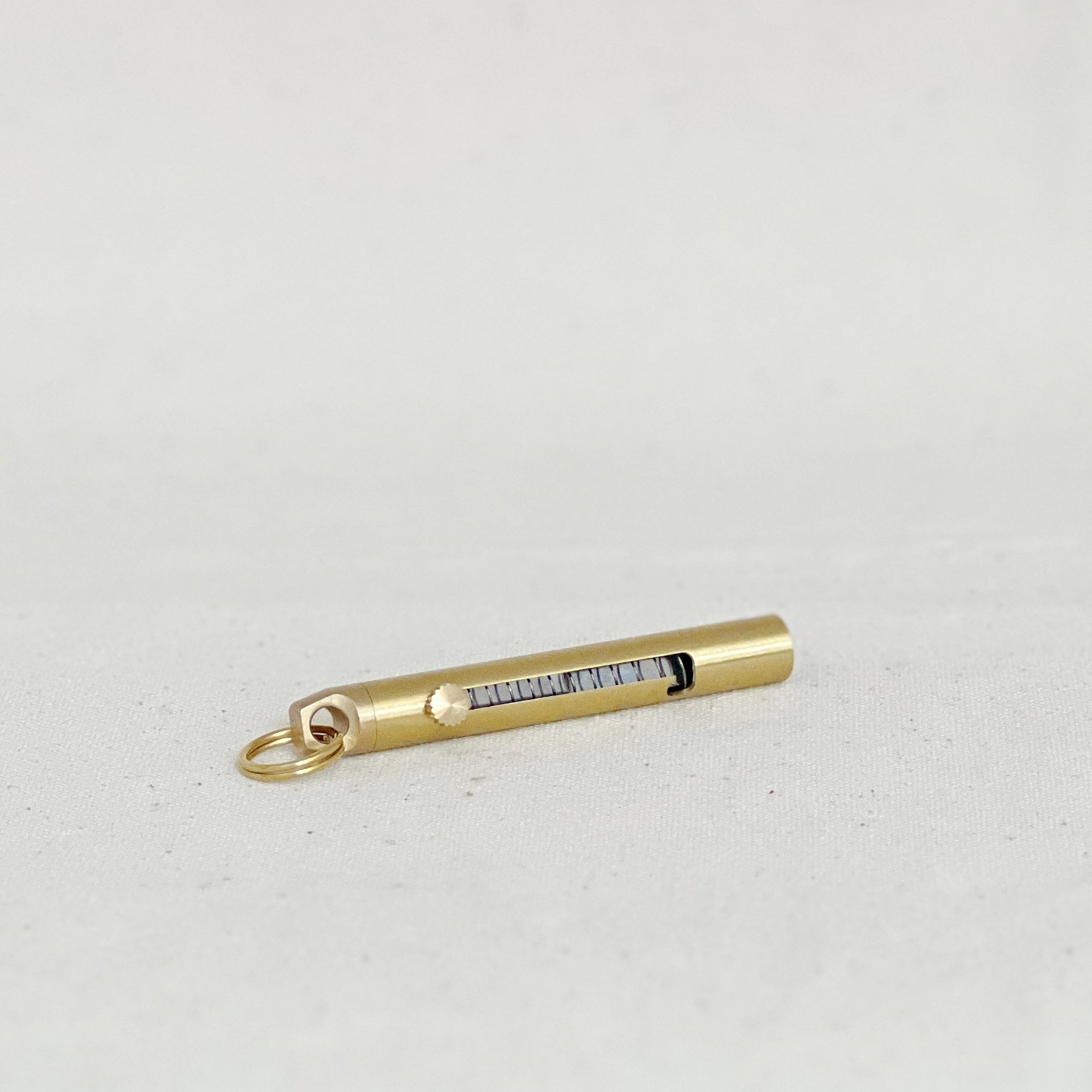 This brass mini folding knife is a compact, stylish EDC essential with a precision blade, smooth sliding mechanism, and timeless design. Durable and versatile.