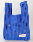Give your daily style a playful pop with this bright blue knit shoulder bag. Its open, airy weave keeps things lightweight, while the roomy shape makes it perfect for errands, outings, and everything in between. Soft, flexible, and easy to style, it adds a fun hit of texture to any look.