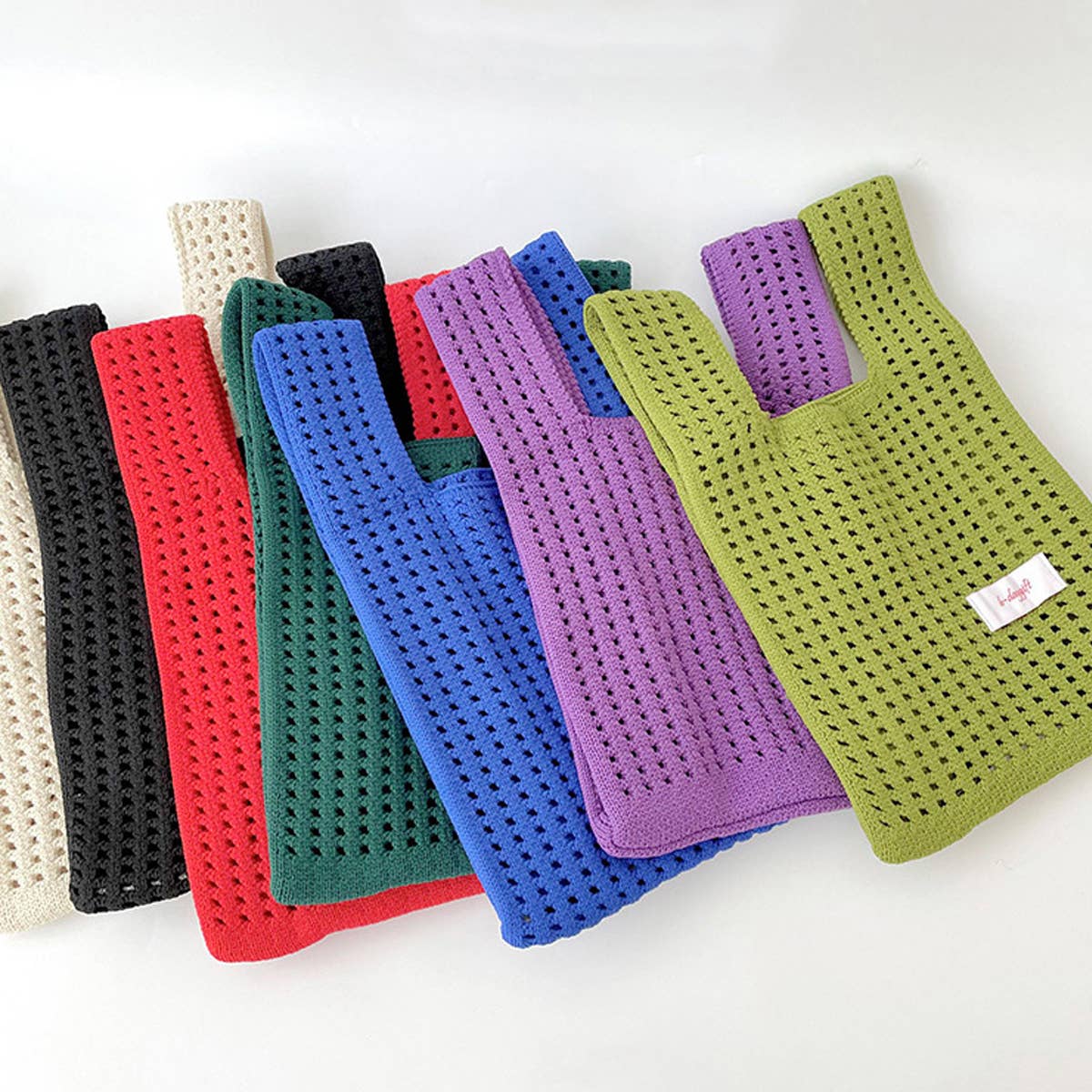 Give your daily style a playful pop with this bright blue knit shoulder bag. Its open, airy weave keeps things lightweight, while the roomy shape makes it perfect for errands, outings, and everything in between. Soft, flexible, and easy to style, it adds a fun hit of texture to any look.