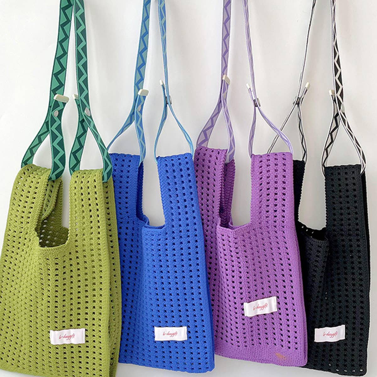 Give your daily style a playful pop with this bright blue knit shoulder bag. Its open, airy weave keeps things lightweight, while the roomy shape makes it perfect for errands, outings, and everything in between. Soft, flexible, and easy to style, it adds a fun hit of texture to any look.