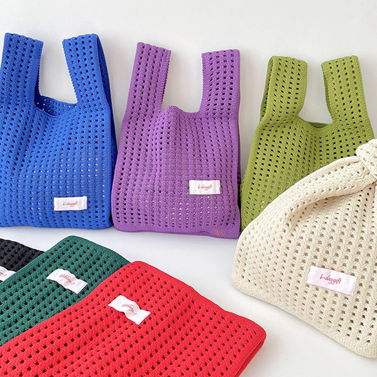 Give your daily style a playful pop with this bright blue knit shoulder bag. Its open, airy weave keeps things lightweight, while the roomy shape makes it perfect for errands, outings, and everything in between. Soft, flexible, and easy to style, it adds a fun hit of texture to any look.