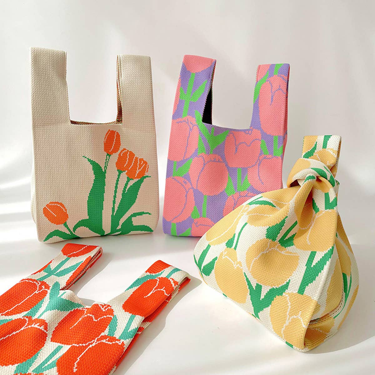 Add a burst of color to your outfit with this orange floral knit shoulder bag. Soft and lightweight, it’s perfect for carrying your essentials while showing off a playful, floral-inspired design. The roomy, flexible shape makes it a charming accessory for casual outings or everyday use.