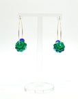 Designed with sculptural flow and oceanic calm, the Large Anchor Hoops feature descending teal floral crystals that create a cascading shape. Finished with two rich cobalt stones for balance, these hoops embody a quiet strength and grounded beauty that stands out without shouting.