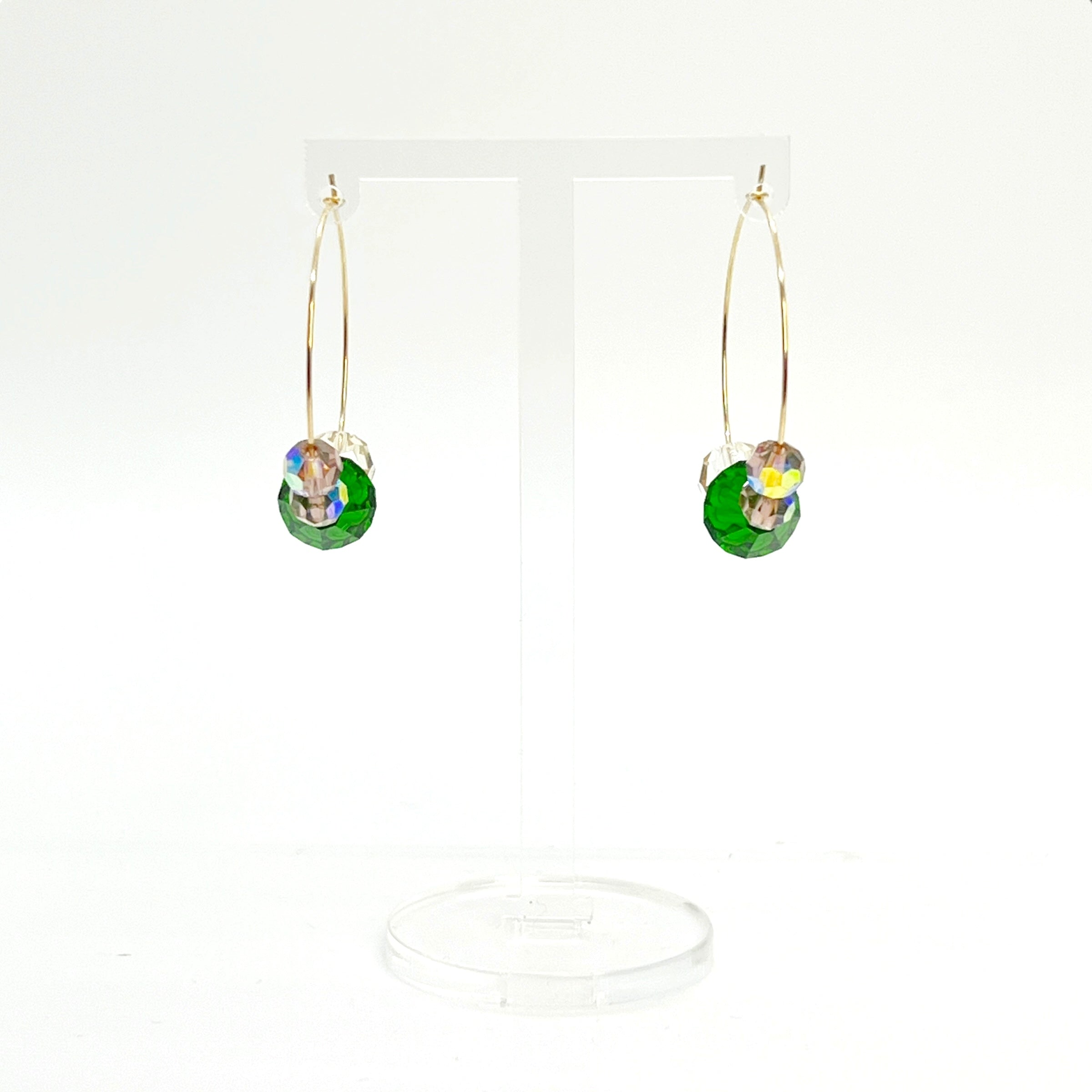 Elegant with a hint of drama, the Large Muse Hoops are a wearable palette of champagne, amethyst, and emerald crystals. Their rich, layered tones and refined silhouette make them a perfect pairing for elevated moments—or everyday beauty with a little mystique.