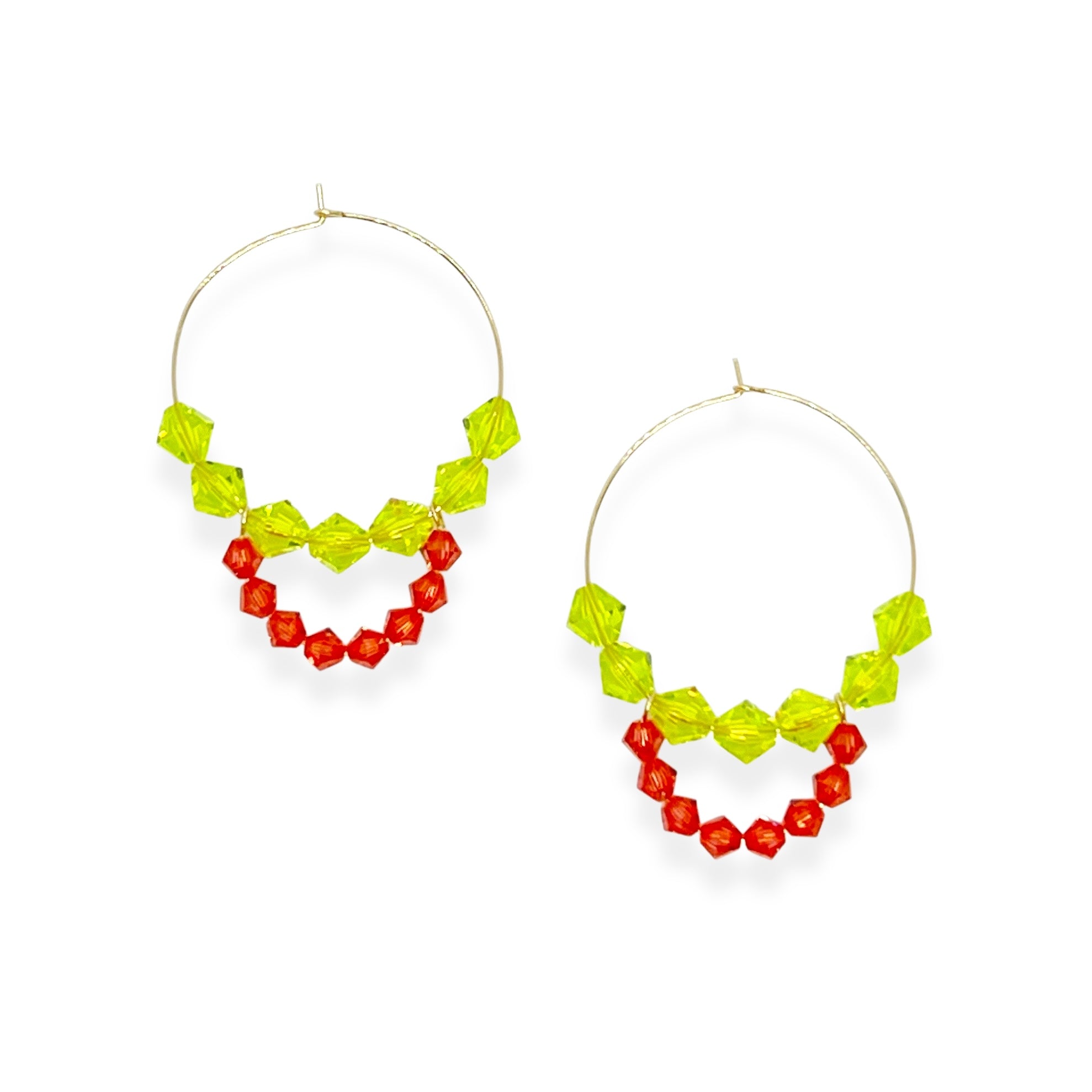 Joyful, flirty, and full of energy—these Small Spark Hoops are a burst of personality. A radiant heart-shaped crystal takes center stage, framed by watermelon and chartreuse tones that feel like summer bottled up. A scattering of dangling crystals adds playful movement, making these hoops perfect for anyone who loves to stand out and shine.
