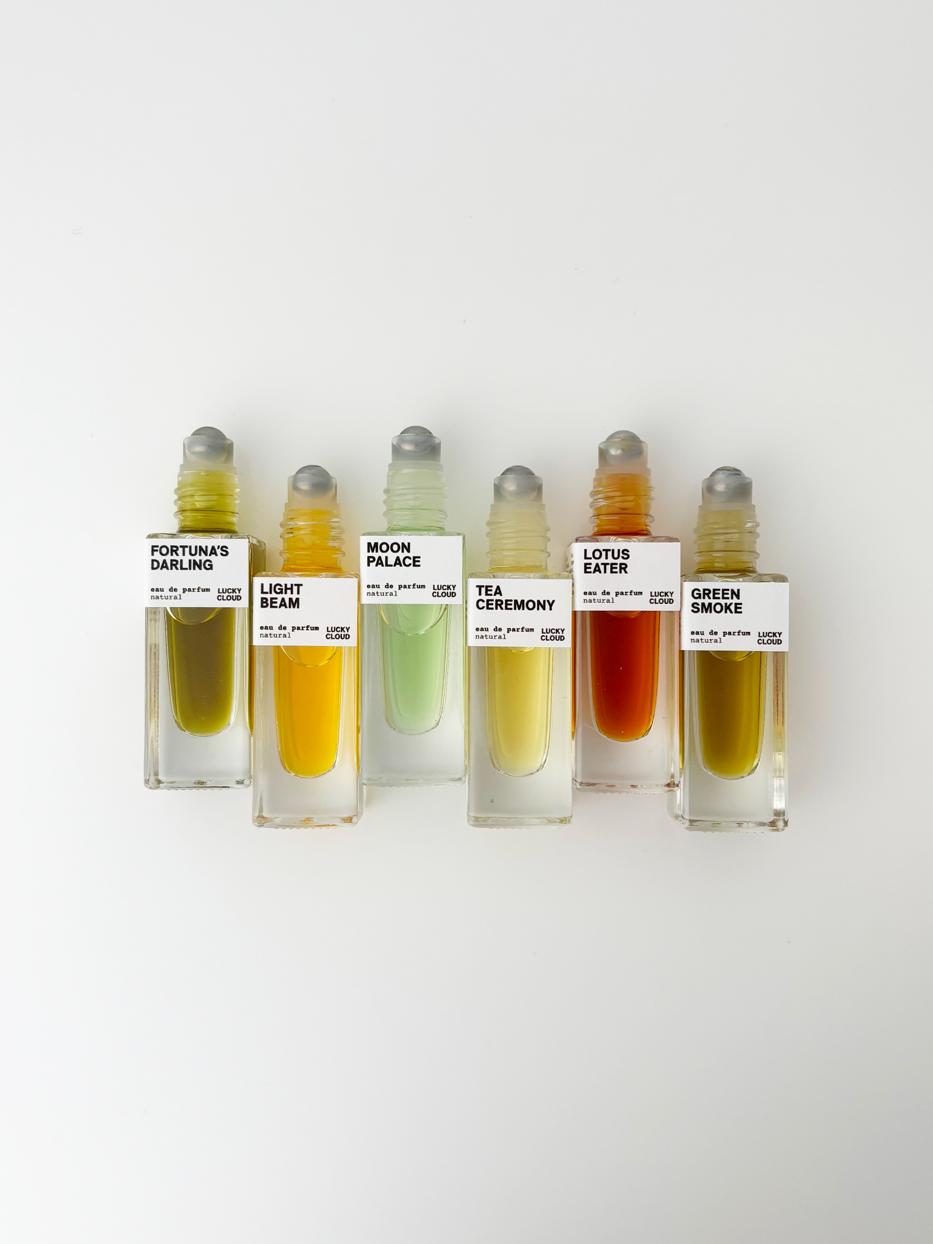 A neon citrus grove lit by Mediterranean sun. Resinous amber drifting through wild blossoms. A bright, surreal landscape where saffron warmth meets coastal breezes. Fortuna’s Darling is a natural Eau de Parfum roll-on that brings the radiance of the Italian coast to your pulse points with vivid layers of citrus, resin, florals, and soft amber musk. This natural perfume evolves quietly on the skin and invites reapplication throughout the day, creating a lively ritual for anyone who prefers a scent that feels